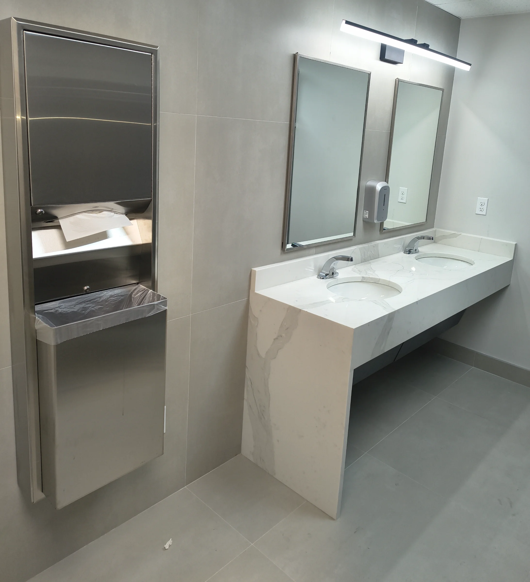 Double-sink vanity with undermount basins and faucets