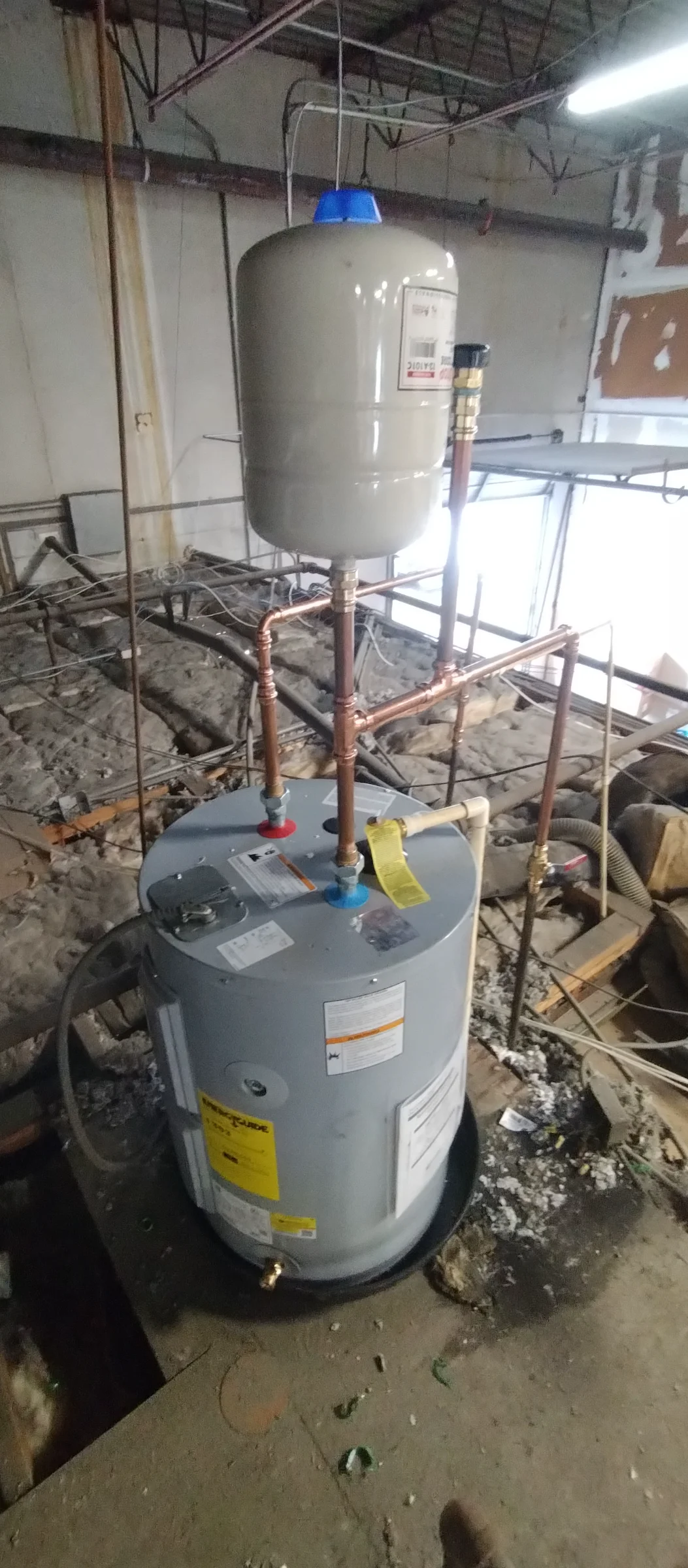 Commercial water heater above the ceiling